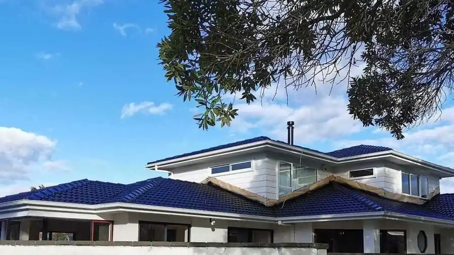 Roof painting and restoration on a West Auckland family home by My Homes Construct Ltd