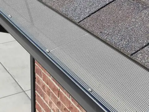Scheduled gutter maintenance and guard fitting, Auckland Scheduled gutter maintenance and guard fitting in progress on an Auckland property