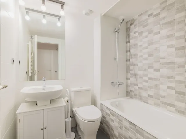 Modern bathroom renovation with new tiling completed for an Auckland home by My Homes Construct Ltd