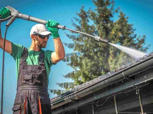 Roof cleaning and soft wash on a tiled roof, Auckland Roof cleaning and soft wash on a tiled roof in progress on an Auckland property