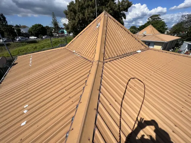 Roof painting and protective coating on a metal roof completed for an Auckland home by My Homes Construct Ltd